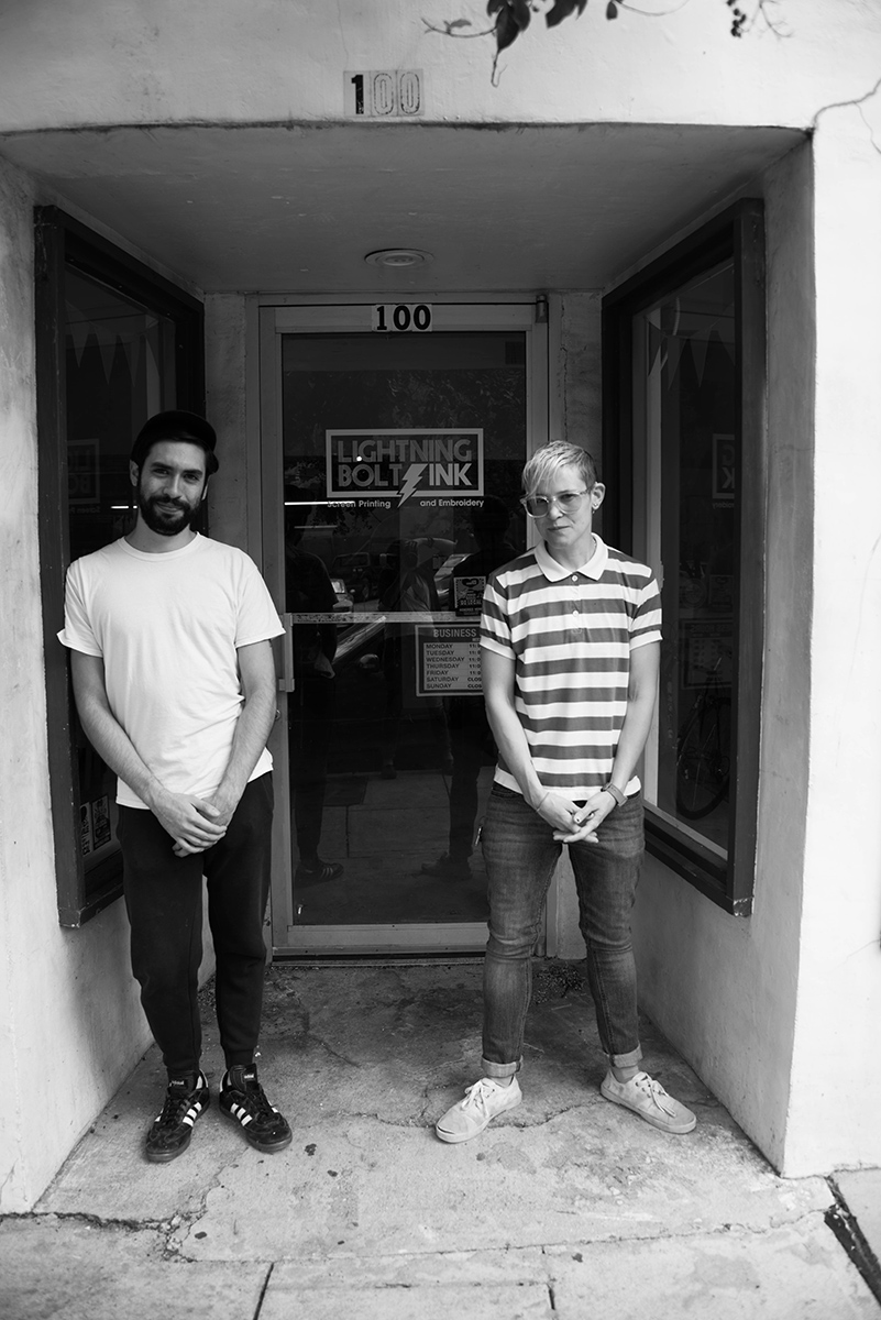 Graphic Designer Estbean Gonzalez and Owner SB in the doorway of Lightning Bolt Ink. Photo: Erin Fowler